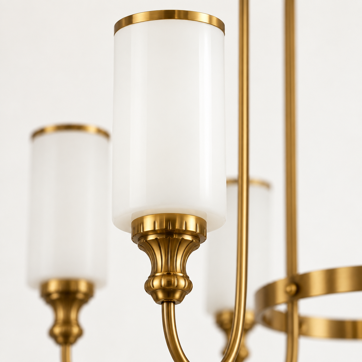 Close-up of white cylindrical glass shade with GAB detailing